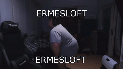 A Man Wearing Headphones Stands In Front Of A Chair That Says Ermesloft On It GIF