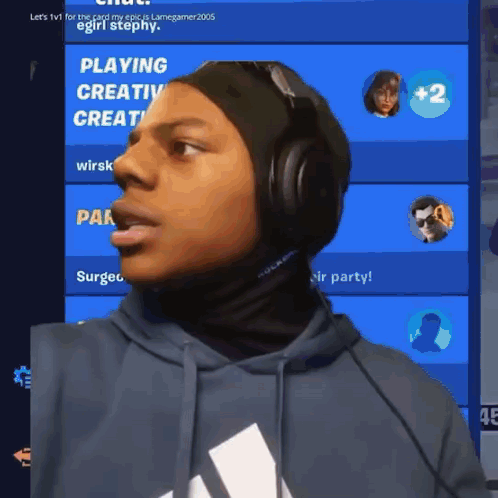 A Man Wearing Headphones Stands In Front Of A Screen That Says Playing Creative GIF