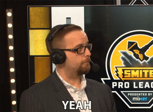 A Man Wearing Headphones Stands In Front Of A Smite Pro League Logo GIF