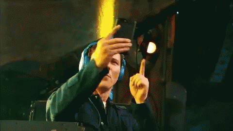 A Man Wearing Headphones Takes A Picture Of Himself GIF