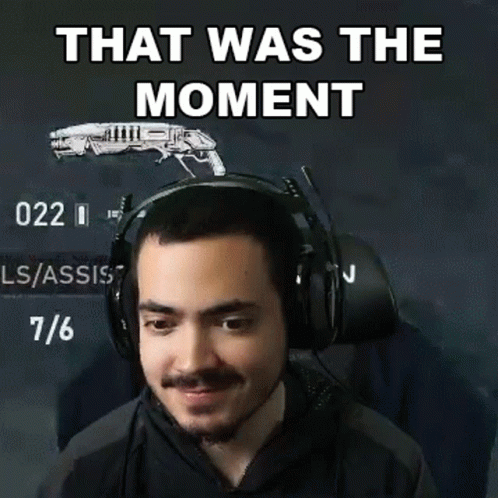 A Man Wearing Headphones With A Gun In The Background And The Words That Was The Moment GIF