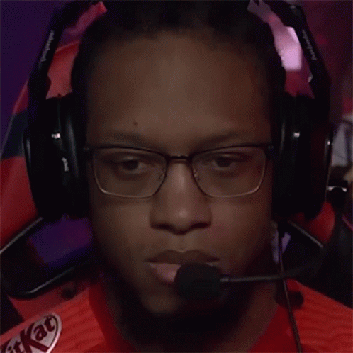 A Man Wearing Headphones With A Kitkat Logo On His Shirt GIF