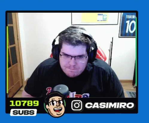 a man wearing headphones with the number 10 on the back of his shirt