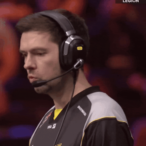 A Man Wearing Headphones With The Word Legion On The Bottom Right GIF