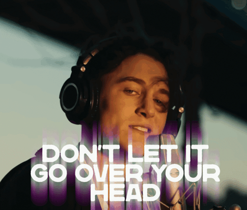 A Man Wearing Headphones With The Words " Do N't Let It Go Over Your Head " Above Him GIF