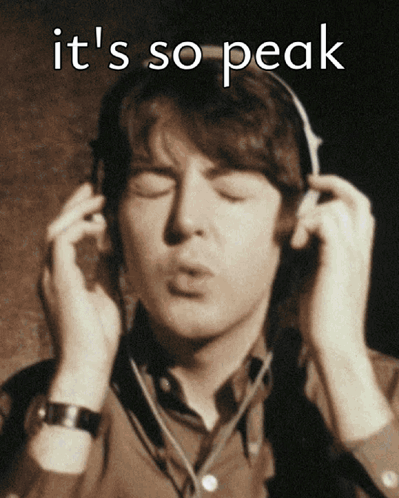 A Man Wearing Headphones With The Words It 'S So Peak Written Above Him GIF
