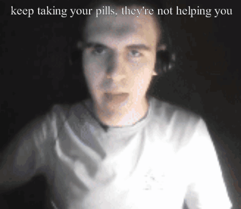 A Man Wearing Headphones With The Words Keep Taking Your Pills They 'Re Not Helping You Above Him GIF