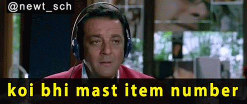 A Man Wearing Headphones With The Words Koi Bhi Mast Item Number Above Him GIF