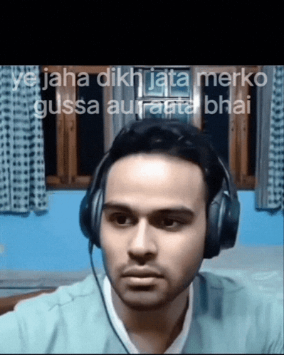 a man wearing headphones with the words " ya jaha dikhaita merko gussa auranta bhai " behind him