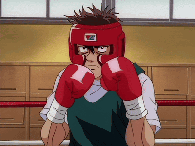 A Man Wearing Red Boxing Gloves And A Red Helmet With The Letter Z On It GIF