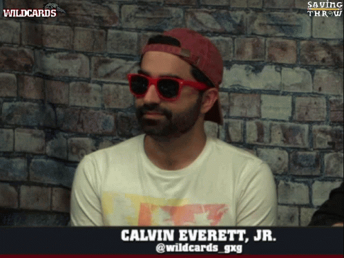 A Man Wearing Red Sunglasses And A Red Hat Is Named Calvin Everett Jr. GIF
