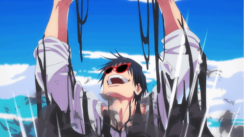 A Man Wearing Red Sunglasses Is Covered In A Black Substance GIF