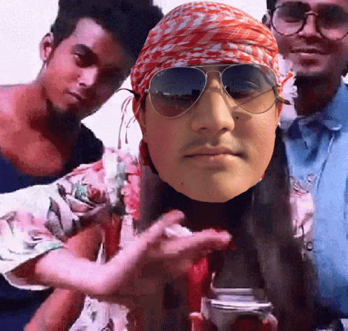 A Man Wearing Sunglasses And A Bandana Holds A Camera GIF