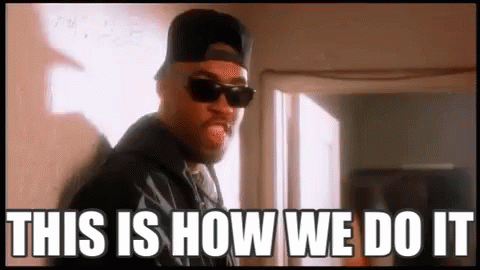 A Man Wearing Sunglasses And A Baseball Cap Is Standing In Front Of A Window And Says `` This Is How We Do It '' . GIF
