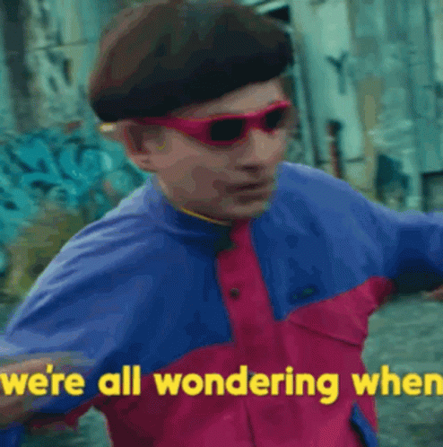 A Man Wearing Sunglasses And A Beret Says `` We 'Re All Wondering When '' GIF