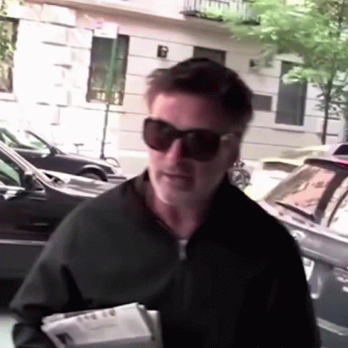 Man Wearing Sunglasses Holding Box GIF