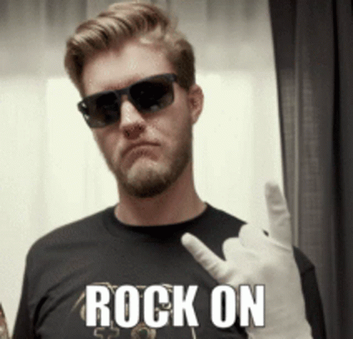 A Man Wearing Sunglasses And A Black Shirt With The Word Rock On On It GIF