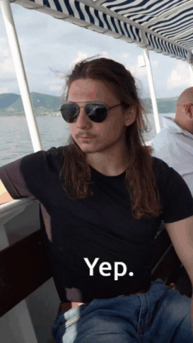 A Man Wearing Sunglasses And A Black Shirt With The Word Yep On The Front GIF