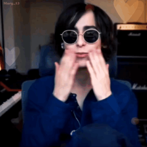 Man In Blue Shirt And Sunglasses Sitting At Piano GIF