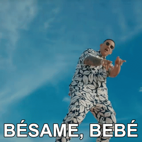 A Man Wearing Sunglasses And A Blue Shirt Says Besame Bebe In Spanish GIF