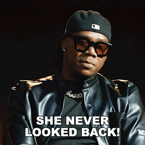 A Man Wearing Sunglasses And A Hat Says " She Never Looked Back " GIF