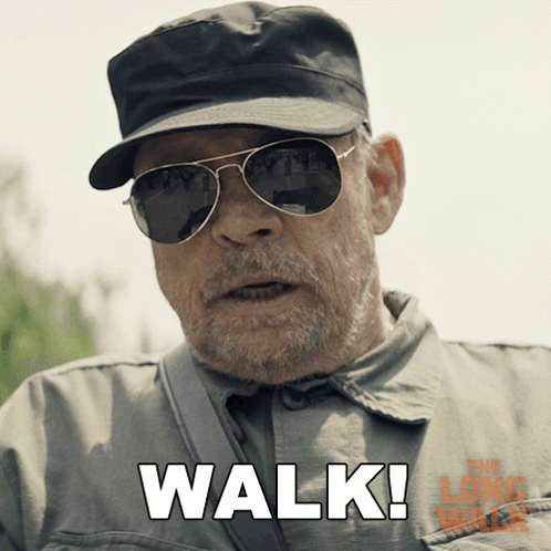 A Man Wearing Sunglasses And A Hat Says " Walk " In White Letters GIF