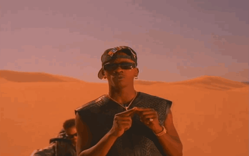 A Man Wearing Sunglasses And A Hat That Says ' Chicago Bulls ' On It GIF