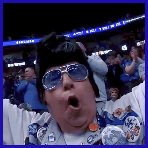 A Man Wearing Sunglasses And A Hat With A Badge That Says March On It GIF