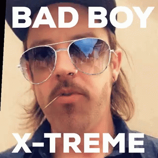 A Man Wearing Sunglasses And A Hat With The Words Bad Boy X-Treme GIF