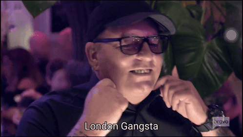 A Man Wearing Sunglasses And A Hat With The Words London Gangsta Written Below Him GIF