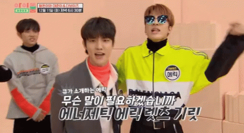 A Man Wearing Sunglasses And A Jacket That Says ' Balenciaga ' On It Stands Next To Another Man In A Suit GIF