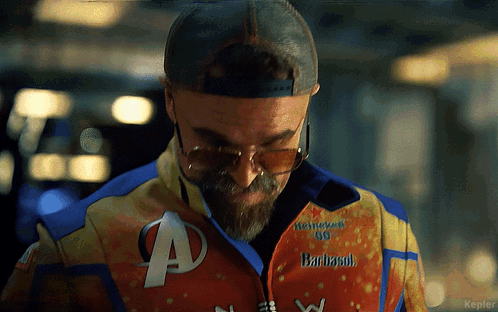 Man Wearing Sunglasses And Barbasol Jacket GIF