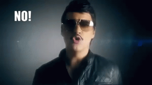 A Man Wearing Sunglasses And A Mustache Is Singing A Song In A Dark Room . GIF