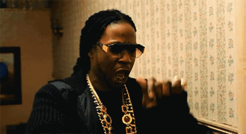 A Man Wearing Sunglasses And A Necklace That Says Pop GIF