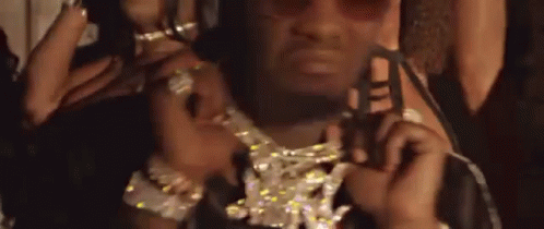 Man Wearing Sunglasses And Diamond Necklace Holding Key GIF