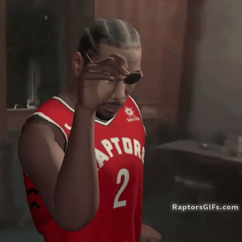 A Man Wearing Sunglasses And A Red Jersey With The Number 2 On It GIF
