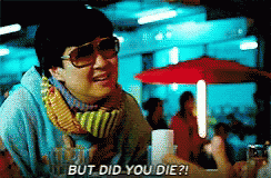 A Man Wearing Sunglasses And A Scarf Is Saying But Did You Die GIF
