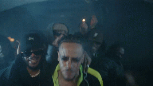 A Man Wearing Sunglasses And A Stussy Hat GIF