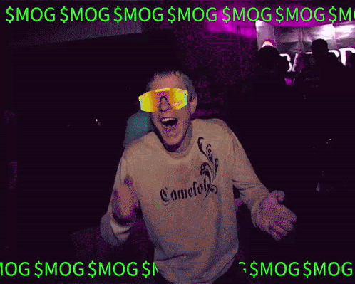 A Man Wearing Sunglasses And A Sweatshirt Is Dancing In A Club GIF