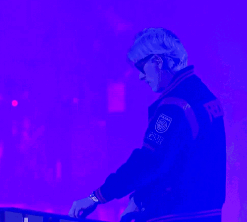 A Man Wearing Sunglasses And A Varsity Jacket That Says Power On The Back GIF