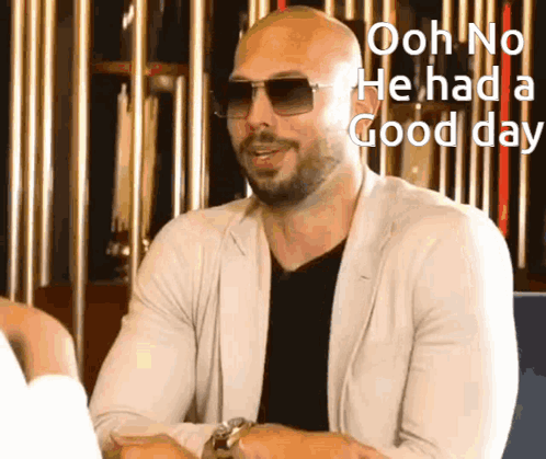 A Man Wearing Sunglasses And A White Jacket Says Ooh No He Had A Good Day GIF