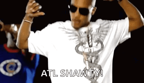 A Man Wearing Sunglasses And A White Shirt With The Word Atl Shawty On It . GIF