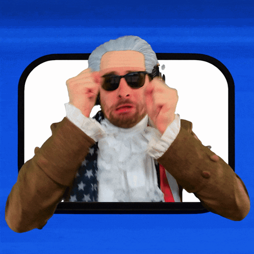 A Man Wearing Sunglasses And A Wig Is Making A Funny Face GIF