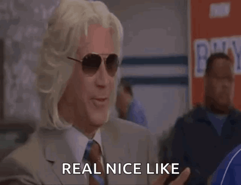 A Man Wearing Sunglasses And A Wig Says Real Nice Like GIF
