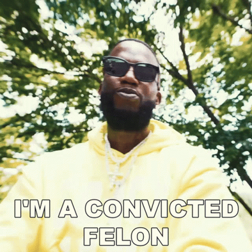 A Man Wearing Sunglasses And A Yellow Hoodie Has The Words I 'M A Convicted Felon Below Him GIF