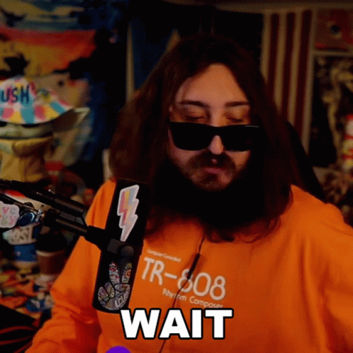 A Man Wearing Sunglasses And An Orange Shirt With Tr-808 On It GIF