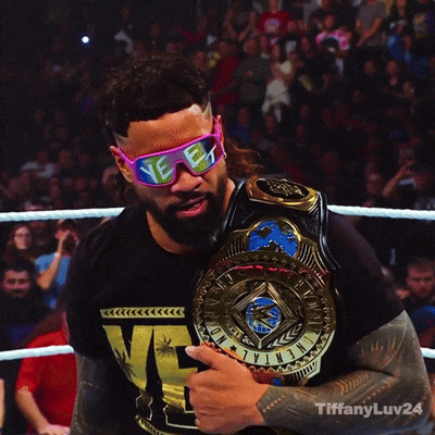A Man Wearing Sunglasses And Holding A Championship Belt With Tiffanyluv24 Written Below Him GIF