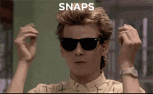 A Man Wearing Sunglasses Has The Word Snaps Written On His Head GIF
