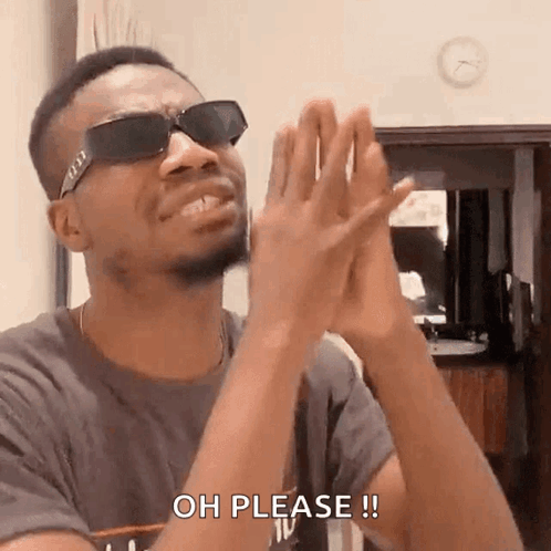 A Man Wearing Sunglasses Is Clapping His Hands And Says Oh Please . GIF