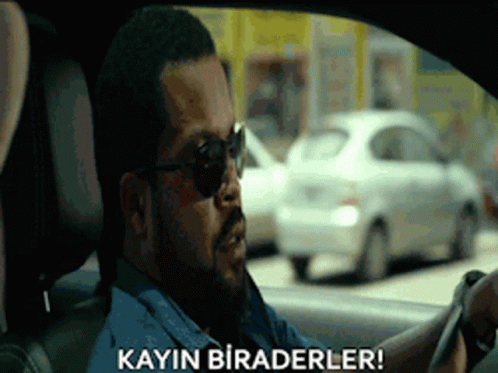 A Man Wearing Sunglasses Is Driving A Car And Says Kayin Biraderler ! GIF